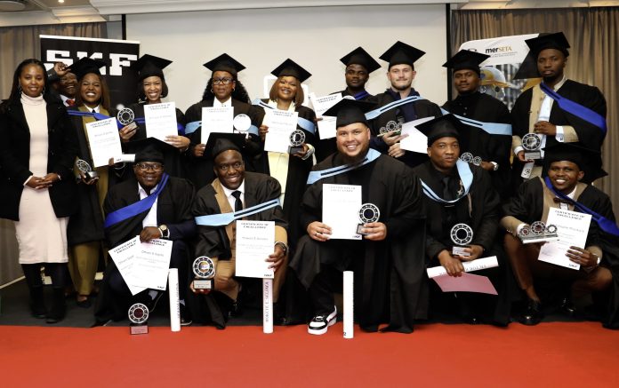 Graduates proudly holding Certificates of Excellence after passing SKF Lubrication Equipment Mechanics program